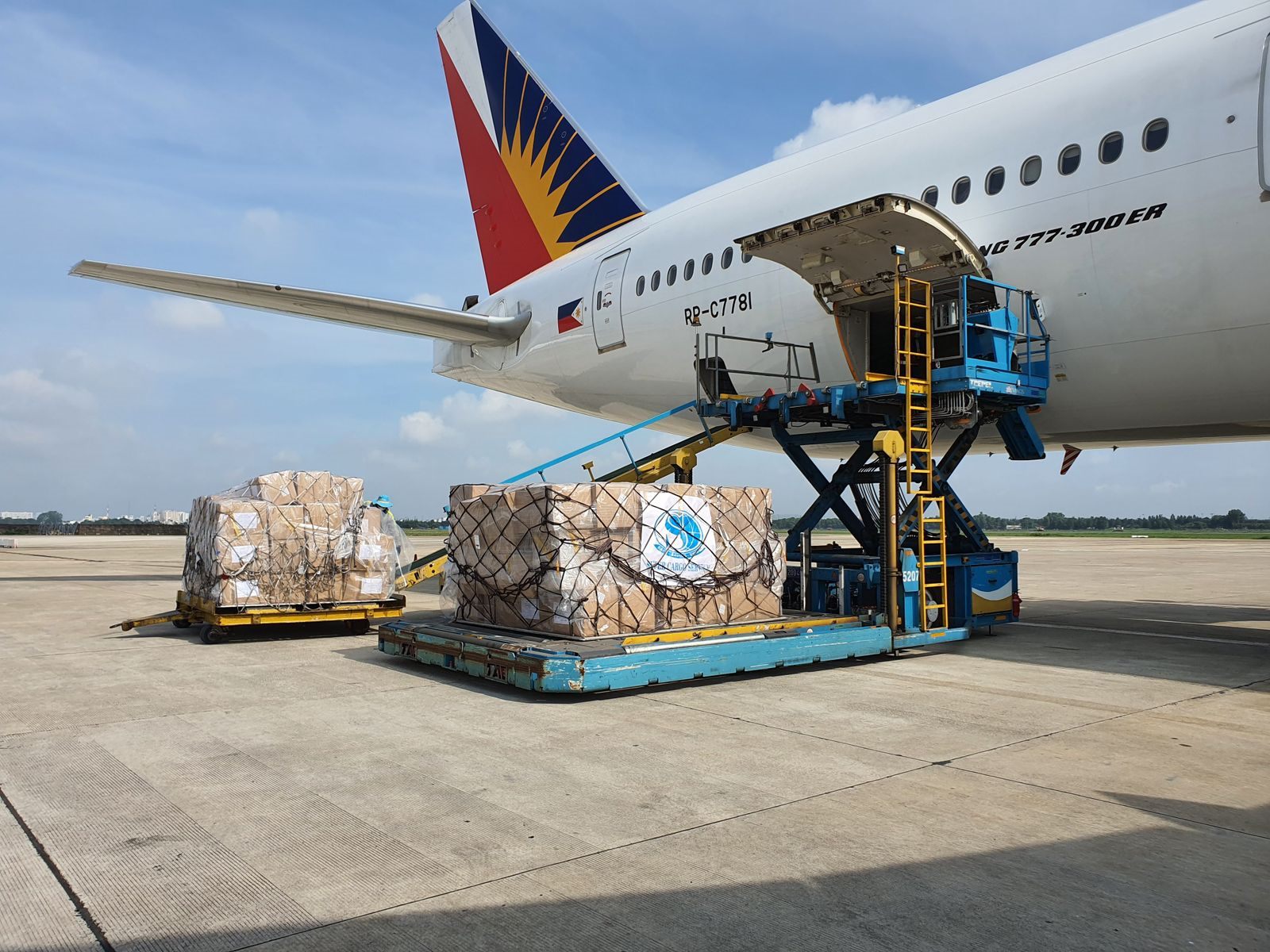 Air freight pallets being loaded into an aircraft